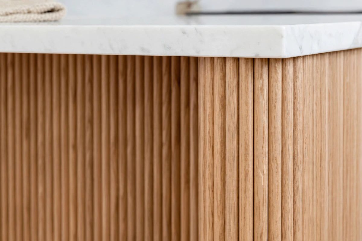 Close-up of fluted kitchen island in White Oak